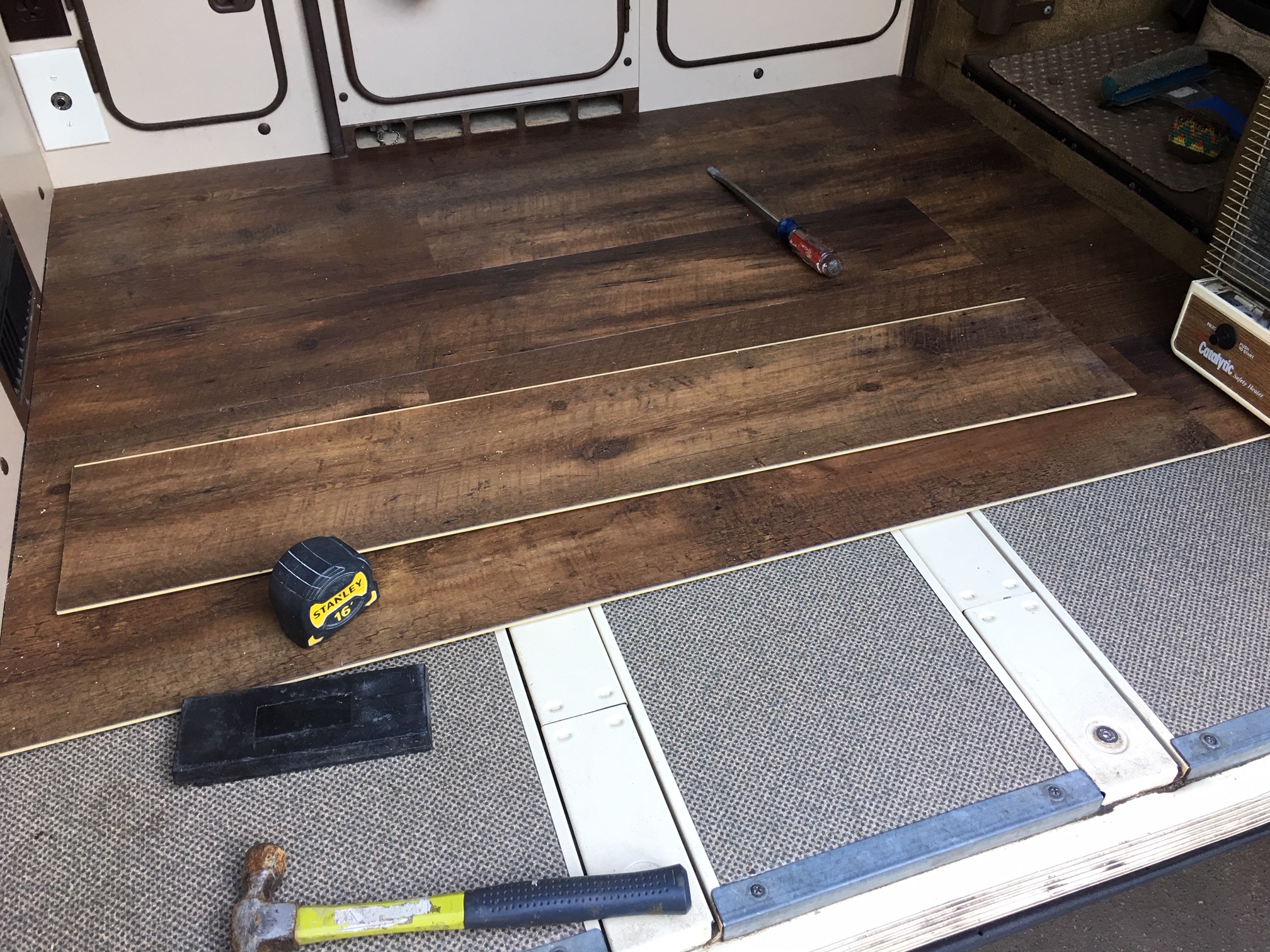 flooring being installed in the van